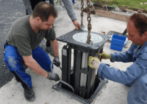 ANNT team installing an automatic retractable bollard.